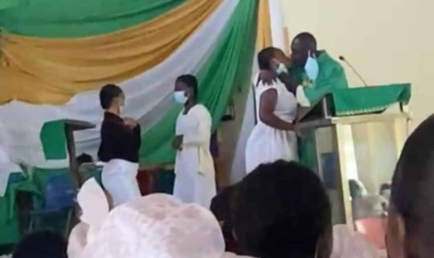 Watch Video: Anglican Priest captured 'force-kissing' students at St. Monica's College of Education 1 Anglican Priest Kiss St. Monica's College of Education female students