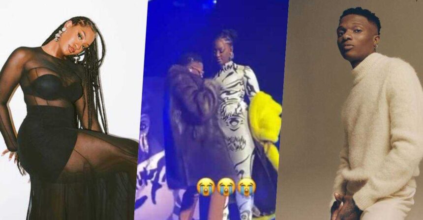 Video: Tems reacts after fans blasted Wizkid for touching her inappropriately on stage