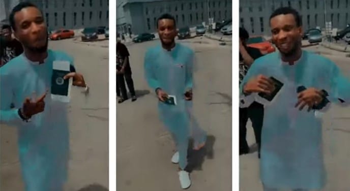 A young Nigerian man rejoices after receiving his Ukraine visa