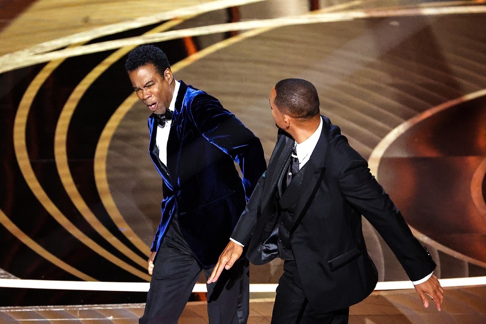 Will Smith slaps Chris Rock onstage at the 94th Academy Awards.