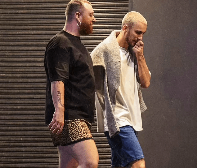Sam Smith Turns Heads in Sydney Rocking Mini-Skirt with Boyfriend