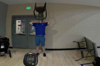 David Rush Wins Guinness World Record for long chair on chin balance