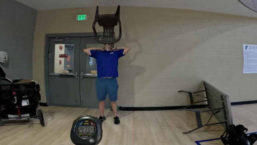 David Rush Wins Guinness World Record for long chair on chin balance