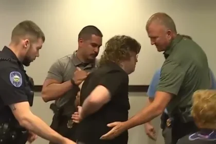 Kansas Teacher Arrested for Clapping at Public Data Center Hearing